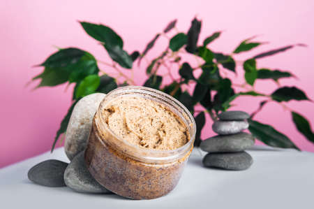 Coffee body scrub on pink background banner. Skincare, health care concept.の写真素材