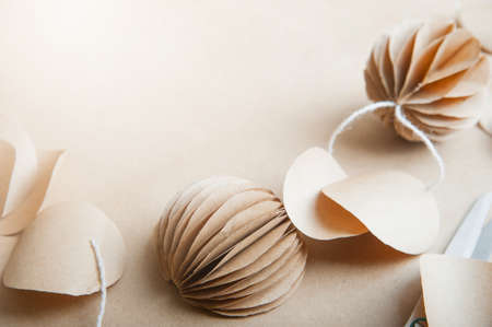 Selective focus. DIY Scandinavian Nordic Craft Paper Christmas Balls. Eco friendly New Year from handmade decor.の写真素材