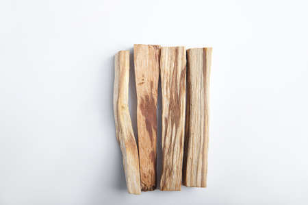 Palo Santo bars close-up and copy space. Ritual cleansing with sacred ibiocai, meditation, aromatherapy with incense and candles.の写真素材