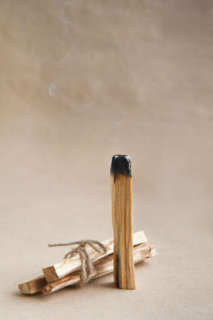 Palo Santo bars close-up and copy space. Ritual cleansing with sacred ibiocai, meditation, aromatherapy with incense and candles.の写真素材