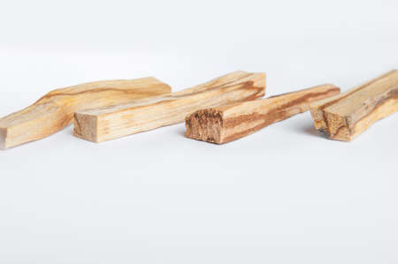 Palo Santo bars close-up and copy space. Ritual cleansing with sacred ibiocai, meditation, aromatherapy with incense and candles.の写真素材