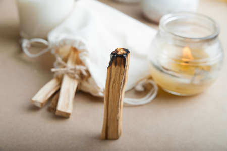 Palo Santo bars close-up and copy space. Ritual cleansing with sacred ibiocai, meditation, aromatherapy with incense and candles.の写真素材