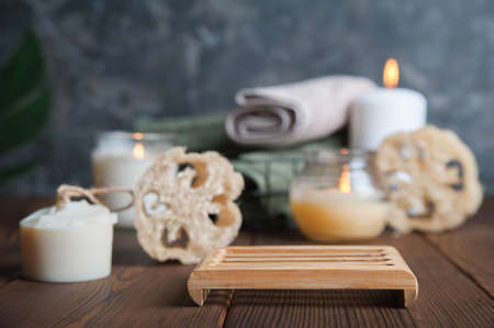 Podium in bathroom and natural soap, loofah scrubber. Zero waste in life. Relaxation spa concept, candles, beauty...の写真素材
