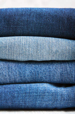 Stack of textured jeans close up and copy space..の写真素材