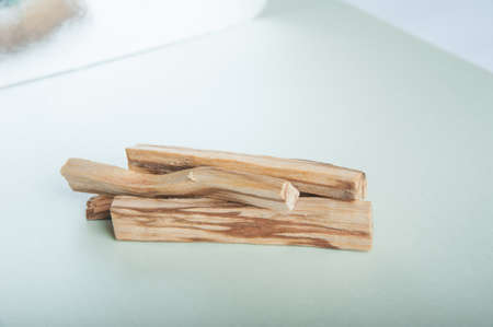 Palo Santo bars close-up and copy space. Ritual cleansing with sacred ibiocai, meditation, aromatherapy with incense and candles..の写真素材