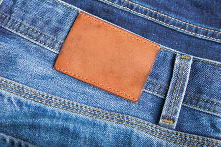 Leather tag label on jeans close up and copy spaceの写真素材