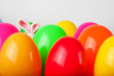 Lots of colorful eggs and rabbit ears..の写真素材