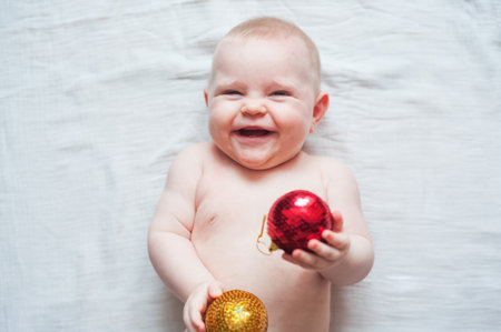 Cute baby 7 months old and Christmas balls. My first Christmas concept..の写真素材