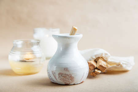 Palo Santo bars close-up and copy space. Ritual cleansing with sacred ibiocai, meditation, aromatherapy with incense and candles.の写真素材