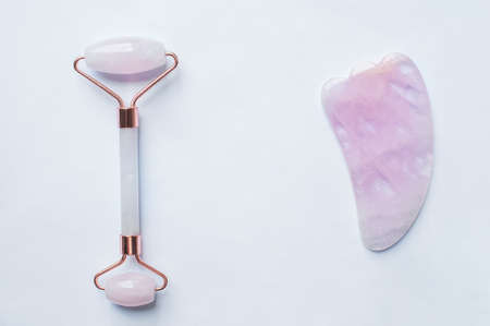 Roller marble facial massagers on white background.の写真素材