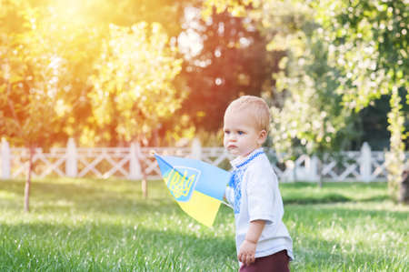 Toddler boy in Ukrainian vyshyvanka in summer.の写真素材