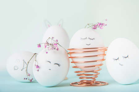 Easter eggs with painted face as concept for festive spring card..の写真素材