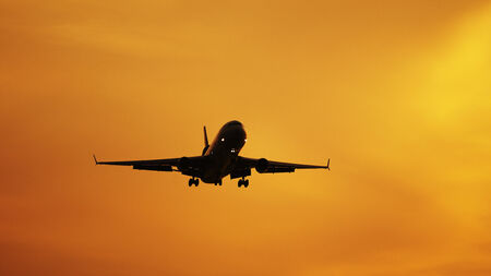 Private Jet against burning skyの写真素材