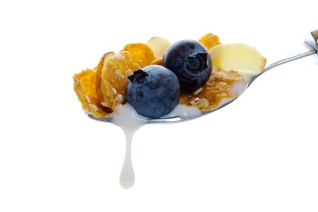 Hearty oat and wheat flake cereal with crunchy almonds and fresh blueberries.  Shot on white...
