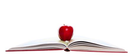 A rosy, red apple on a school atlas.の写真素材