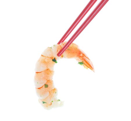 Marinated Garlic Shrimp in red chopsticks.  Shot on white background.の写真素材