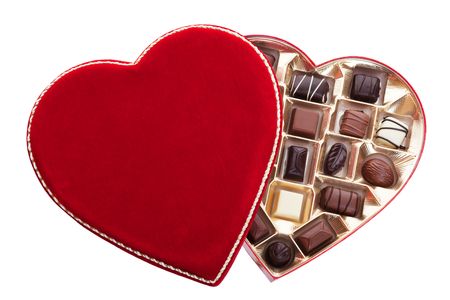 Red velvet, heart shaped box of chocolates.  Shot on white background.の写真素材