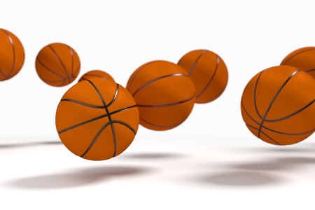 Levitation of the basketballs in front of the white background. Focus to the nearest ball.の写真素材