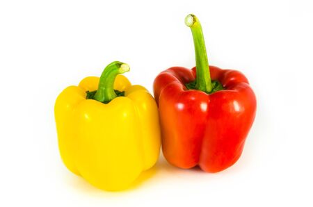 YELLOW RED BELL PEPPER ON WHITE BACKGROUNDの写真素材