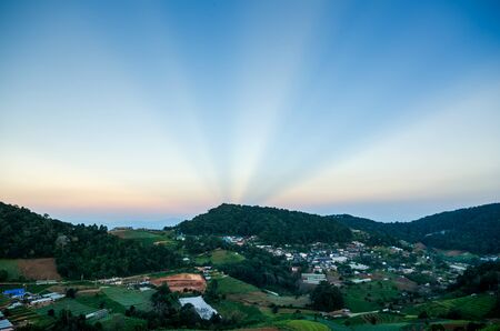blue and orange sky from sunset at the mountain backgroundの写真素材