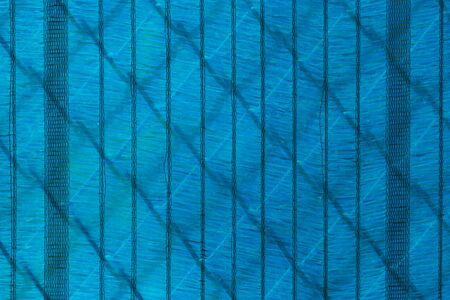 Abstract background- blue wire squares with and various shaped shadows.の写真素材