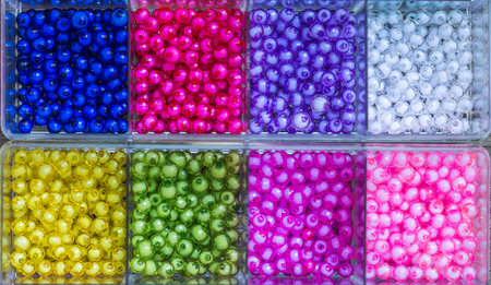 Large collection of colourful beads in boxesの写真素材