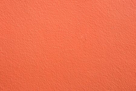 orange background of rough concrete wall texture.の写真素材