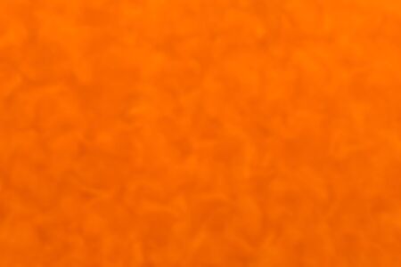 blurred orange tone background textureの写真素材