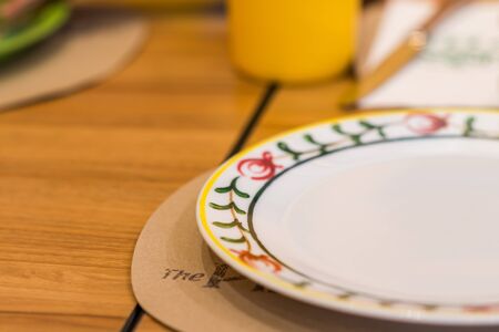 Empty dish over wood table backgroundの写真素材