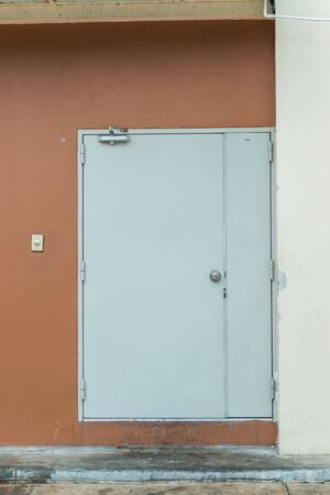white door on a brown wallの写真素材