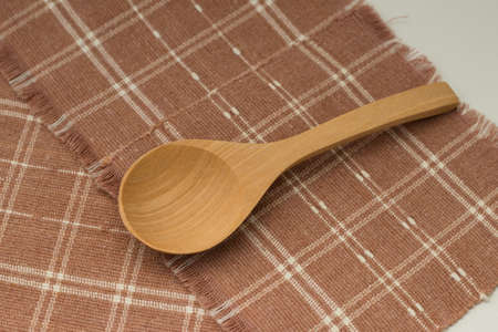 wooden Spoon on the table covered with cottonの写真素材