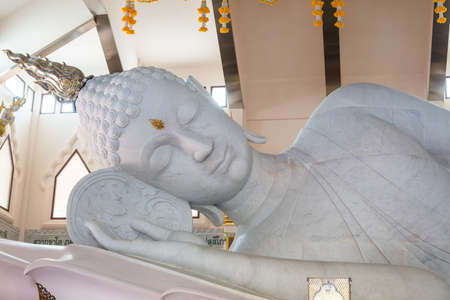 The white big Buddha statue on blue sky background in Thailandの写真素材