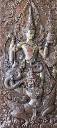 Bronze bas reliefs buddhism in wat pa phu kon in thailandのeditorial素材