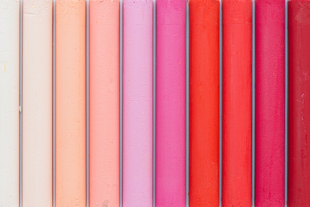 Colorful oil pastels in a box, close up, macro, full frame