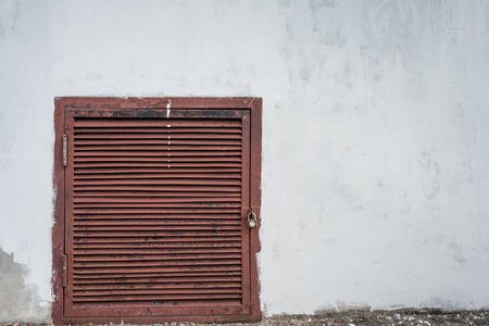 Old small door in cracked wallの写真素材