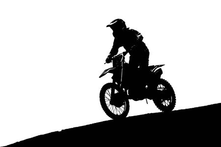 Silhouette of an extreme driver of a motocross, high jump during training motocrossの写真素材