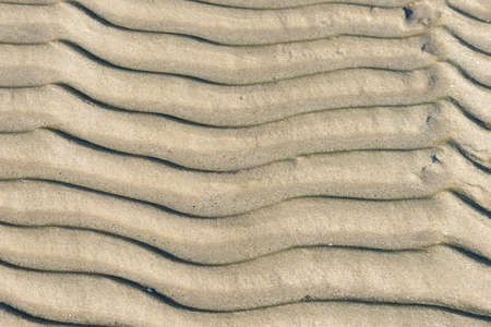 Wave pattern background texture of sandの写真素材
