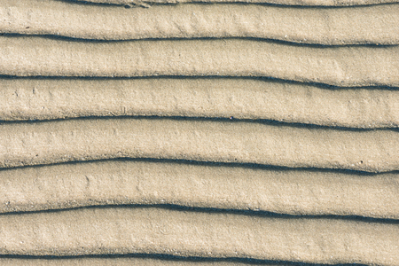 Wave pattern background texture of sandの写真素材