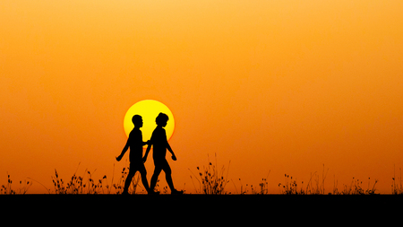 The image of two people in love at sunsetの写真素材