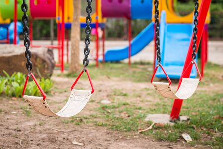 Playground and swings in colorful park