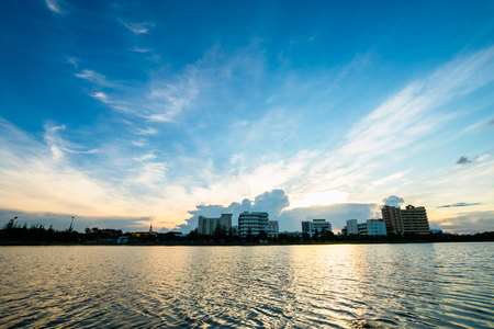 city skyline reflected in lake in nong prajak park, udonthani, Thailandのeditorial素材