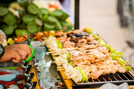 Bar-B-Q or BBQ with kebab cooking. coal grill of chicken meat skewers with mushroom and peppersの写真素材