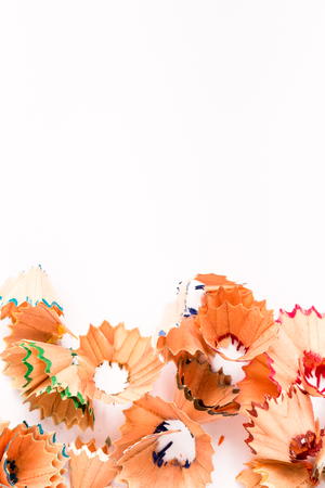 Colorful pencil shavings isolated in white backgroundの写真素材