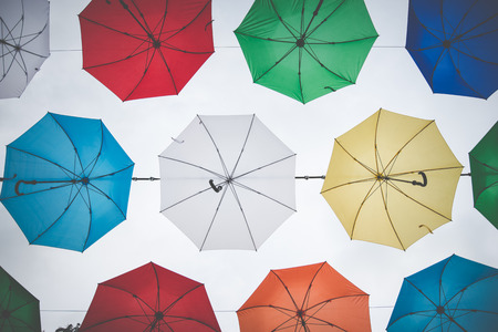 Street decoration with colorful umbrellas in rainy seasonの写真素材