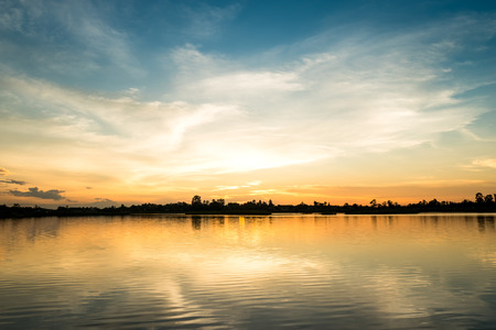 Beautiful colorful sky at sunset on the lakeの写真素材