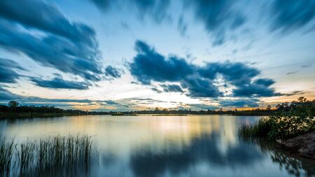 Beautiful colorful sky at sunset on the lake, Long exposure