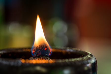 Fires flame from oil lamps on bokeh backgroundの写真素材