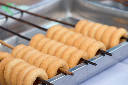 doughnut on street food, prepared or cooked food sold by vendors in a street or other public location for immediate consumptionの写真素材