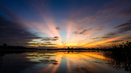 Beautiful colorful sky at sunset on the lakeの写真素材