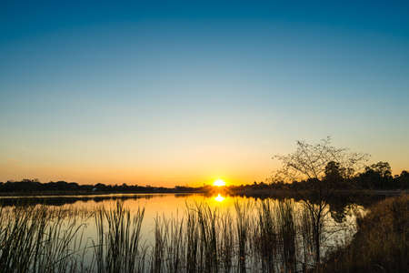 colorful sky at sunset on the lakeの写真素材
